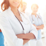 team of doctors with folded arms team of doctors with folded arms