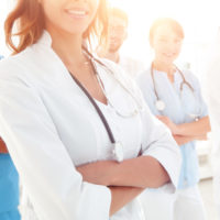 team of doctors with folded arms team of doctors with folded arms