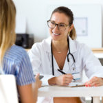 Female doctor explaining diagnosis to her patient. Female doctor explaining diagnosis to her patient.