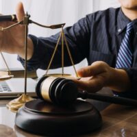 justice and law concept.Male judge in a courtroom on wooden tabl justice and law concept.Male judge in a courtroom on wooden tabl